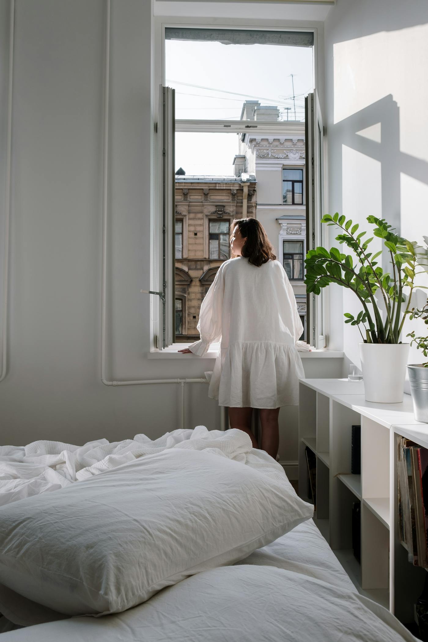 A cool, calm bedroom at night with moonlight through the window